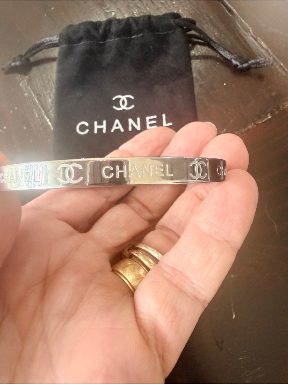 CHANEL Silver Logo-Engraved 
Slim Bangle Bracelet EUC comes with 
Chanel Dusty.